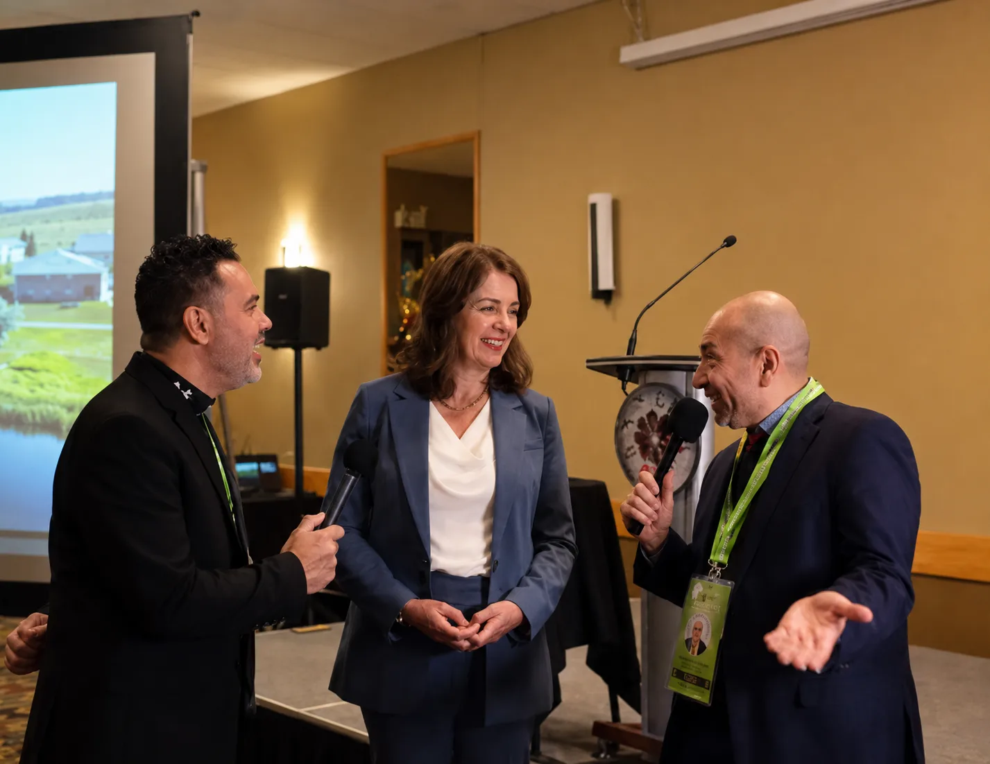 Carlos Castillo talking with leaders at a professional networking event in Alberta, Canada